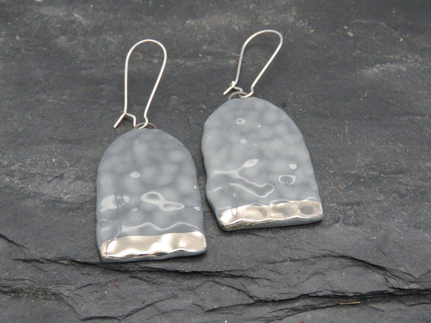 Grey hammered earrings with platinum lustre