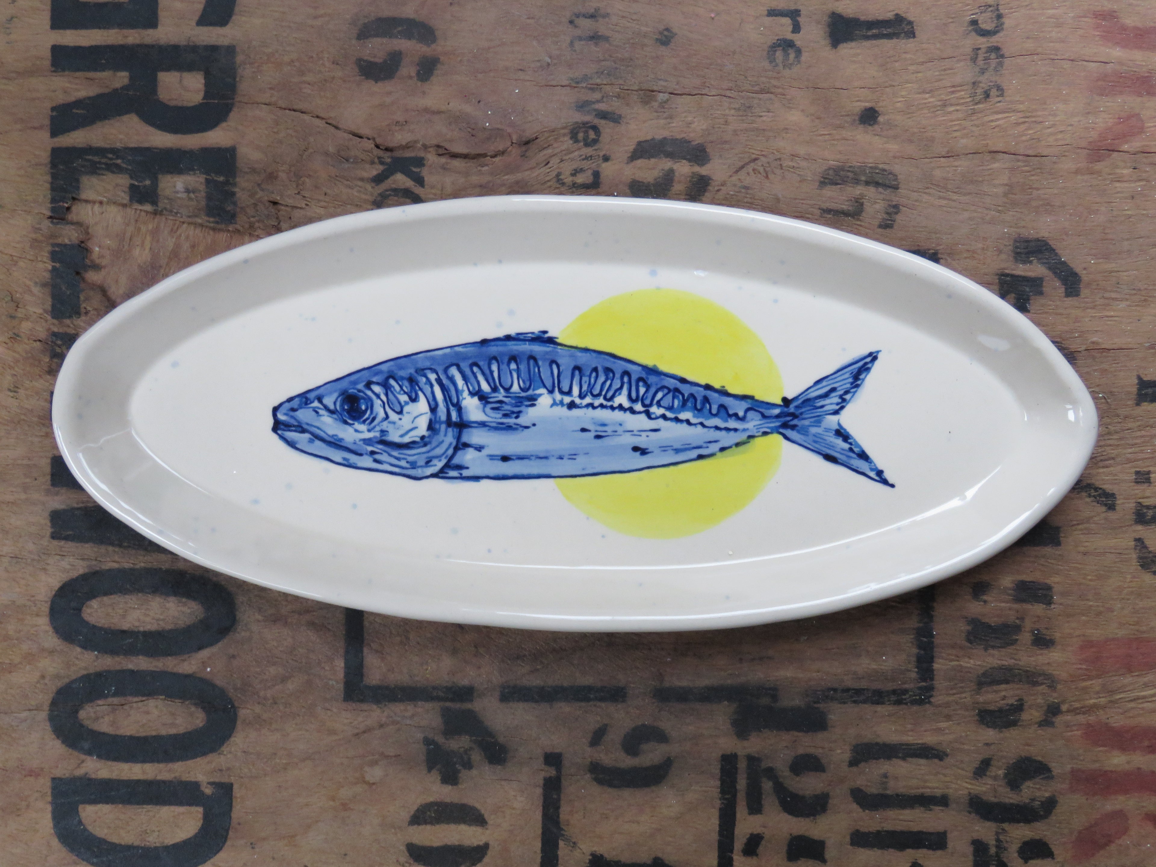 Oblong serving dish with mackerel